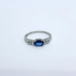Silver ring with a natural navy blue sapphire and white sapphires