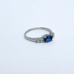 Silver ring with a natural navy blue sapphire and white sapphires