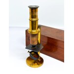 Antique travel microscope with tweezers in a box