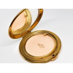 Gold-plated compact with a mirror
