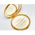 Gold-plated compact with a picture