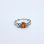 Silver ring with natural orange and white topaz stones