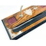 Wooden, metal-rimmed desk stand