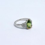 Silver ring with a natural peridot and white topaz