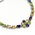 Silver bracelet with natural garnets, peridots, citrines, amethysts, and iolites