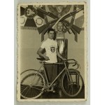 Photograph - Shooting Association Champion, 1936–37. Poznań [cyclist, banner, bust of Piłsudski]