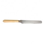 A set of antique knives with light-colored handles decorated with a monogram