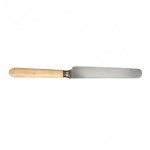 A set of antique knives with light-colored handles decorated with a monogram