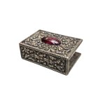 Matchbox with a decorative stone