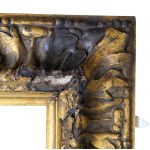 A gilded frame with a flowing oak-leaf ornament