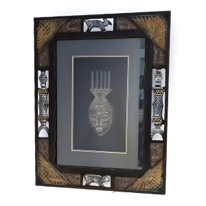 African-style mask in an ornate frame