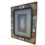 African-style mask in an ornate frame