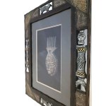 African-style mask in an ornate frame