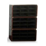 Three-section modular filing cabinet in the Campaign style with twenty-seven wooden and brass compartments