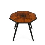 Octagonal coffee table with inlaid design, ebonized wood, and a central inlaid panel; 19th century