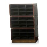 Three-section modular filing cabinet in the Campaign style with twenty-seven wooden and brass compartments