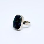 Silver ring with a black Solid opal