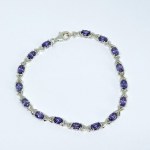 Silver bracelet with purple stones