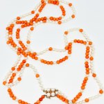 A one-of-a-kind gold necklace made of natural coral and Akoya pearls