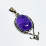 Silver pendant with a large amethyst cabochon