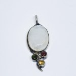Silver pendant with a large moonstone, ruby, tourmaline, and citrine