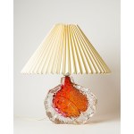 A glass lamp, made of art glass, with a base featuring a beautiful texture and color. Very heavy and impressive.