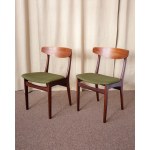 Two chairs made of teak. The seats are upholstered in a thickly woven fabric. Dani, 1970s.