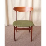 Two chairs made of teak. The seats are upholstered in a thickly woven fabric. Dani, 1970s.