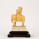 Ivory sculpture depicting a wise man riding an elephant, China, early 20th century