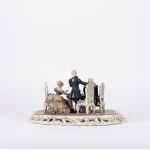 A polychrome porcelain sculptural group depicting checkers players