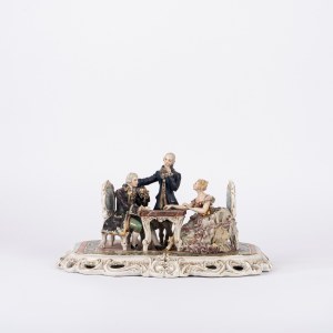 A polychrome porcelain sculptural group depicting checkers players