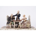 A polychrome porcelain sculptural group depicting checkers players