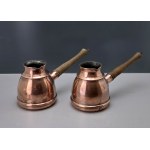 A pair of copper coffee pots from the Metaloplastyka Zakopane workshop