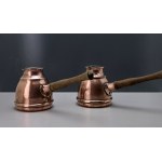 A pair of copper coffee pots from the Metaloplastyka Zakopane workshop