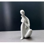 "Lost in Thought" porcelain figurine—designed by Jitka Forejtová—Royal Dux—1960s