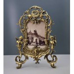 Ornate brass frame with cherubs—second half of the 20th century