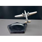 Desk-top business card holder featuring an Art Deco-style airplane model
