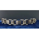 Art Deco - A chunky silver segmented bracelet with hand-engraved floral motifs - 1930s
