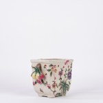Polychrome porcelain flowerpot decorated with floral motifs