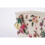 Polychrome porcelain flowerpot decorated with floral motifs