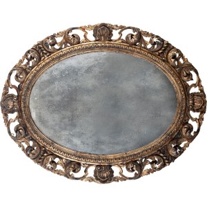 Oval mirror made of gilded and carved wood, in the style of