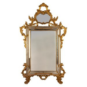 Carved and gilded wooden mirror, in the style of