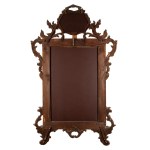 Carved and gilded wooden mirror, in the style of