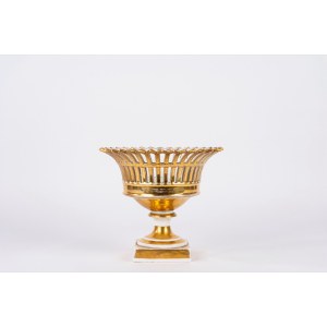 White and gold porcelain cake stand with an openwork design