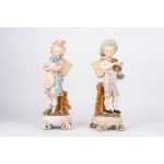 A pair of biscuit sculptures depicting a shepherd boy and a shepherdess
