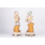 A pair of biscuit sculptures depicting a shepherd boy and a shepherdess