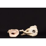 Two white ceramic sculptures