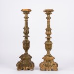 Pair of carved and lacquered wooden candlesticks, 17th century
