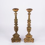 Pair of carved and lacquered wooden candlesticks, 17th century