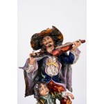 Polychrome Capodimonte porcelain sculpture group depicting a musician and a little beggar, 20th century